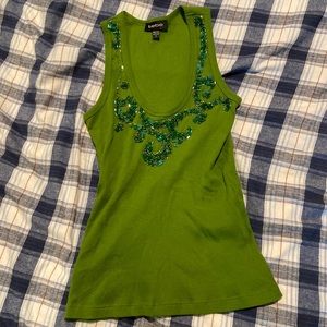 Green sleeveless shirt with green beading around the neck line